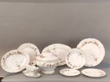 a lot of plates and bowls on the table