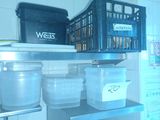 many containers on the shelves in the kitchen
