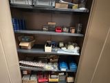 a closet with a lot of items on the shelves