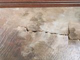 a piece of wood that has been damaged and is sitting on the floor