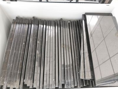 a lot of different types of metal bars in a box