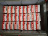 many boxes of red and white cigarettes in a box