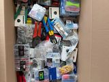 a cardboard box full of assorted items in it