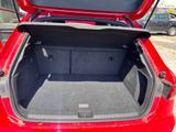 a trunk of a red car with its trunk open