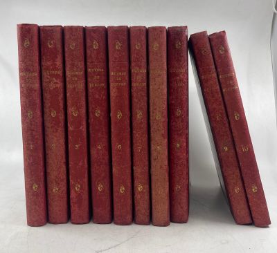 a set of six red books sitting on top of each other