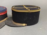 two hats are sitting next to each other on a table