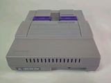 a video game controller sitting on top of a white table