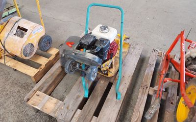 three different types of machines on pallets on the ground