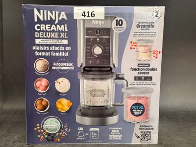 packaging of a blender sitting on top of a counter next to a blender