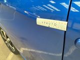 a sticker on the door of a blue car
