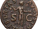 a close up of a coin with a woman on it