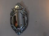 three wall sconces on the wall above a sink