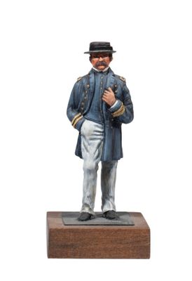 statue of a man in a blue coat and hat standing on a wooden base