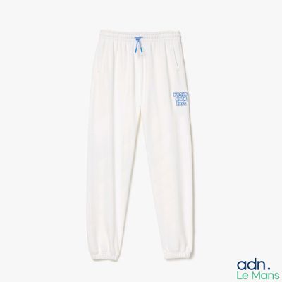un pantalon de survêtement blanc avec un logo bleu sur le côté