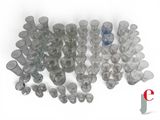 a lot of empty glasses sitting on a white surface