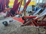 many red chairs that are sitting in the dirt