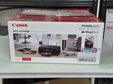 une boîte contenant une imprimante Canon Pixma 6500 posée sur une table