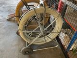 a lot of different types of hoses on a cart
