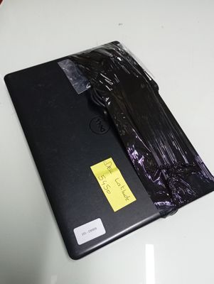 a laptop that is wrapped in plastic on a table