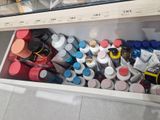 a refrigerator filled with lots of bottles and containers