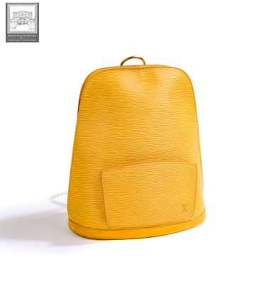 yellow louis vuitton backpack on a white background