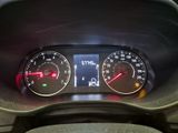 a close up of a car dashboard with a speedometer and gauges