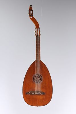 an old wooden instrument hanging from the ceiling