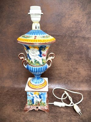a lamp that is sitting on a table with a cord attached to it