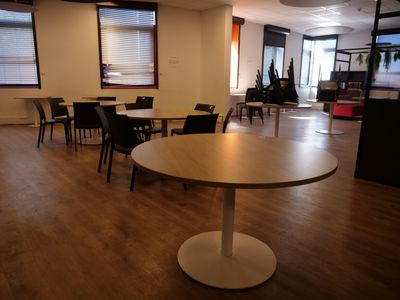 a room with a table and chairs in it