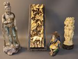 three statues of asian women and a statue of a man