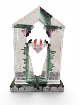 a glass bird feeder with a bird inside of it