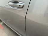 a close up of a car door handle with a sticker on it