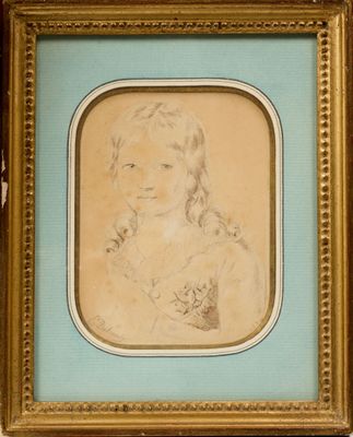 an old picture of a young girl holding a cat in a gold frame