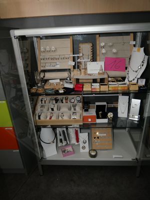 a large open cabinet with many items in it