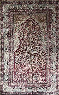 Tapis kirman, centré d'un mihrab, à décor de rinceaux et arb… - Photo 1