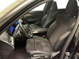 the interior of a car with black leather seats and a steering wheel