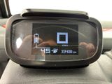 someone is taking a picture of the dashboard of a car with their cell phone