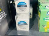 three boxes of mouthwash sitting on a shelf in a store