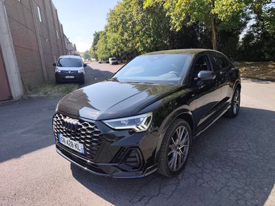 the front of a black audi suv parked in a parking lot