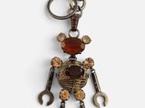 an image of a keychain with a robot made out of tools