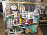 a metal cart with many items in it in a warehouse