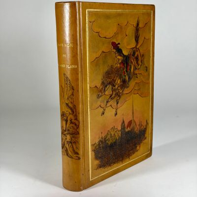 an old book with a picture of a man riding a horse