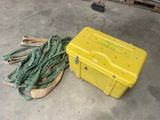 a yellow box with a bunch of hoses next to it