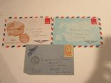 two airmail envelopes on the table and one has a stamp on it