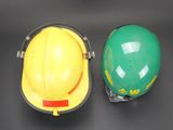 two hard hats sitting next to each other on a table
