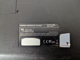 a small battery attached to the back of a laptop