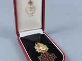 an image of a red case with a gold cross in it