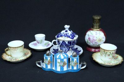 a lot of tea cups and saucers sitting on a table