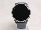 a smart watch sitting on top of a clear stand