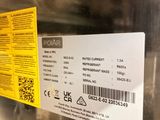 a label on the back of a dishwasher that is not in use